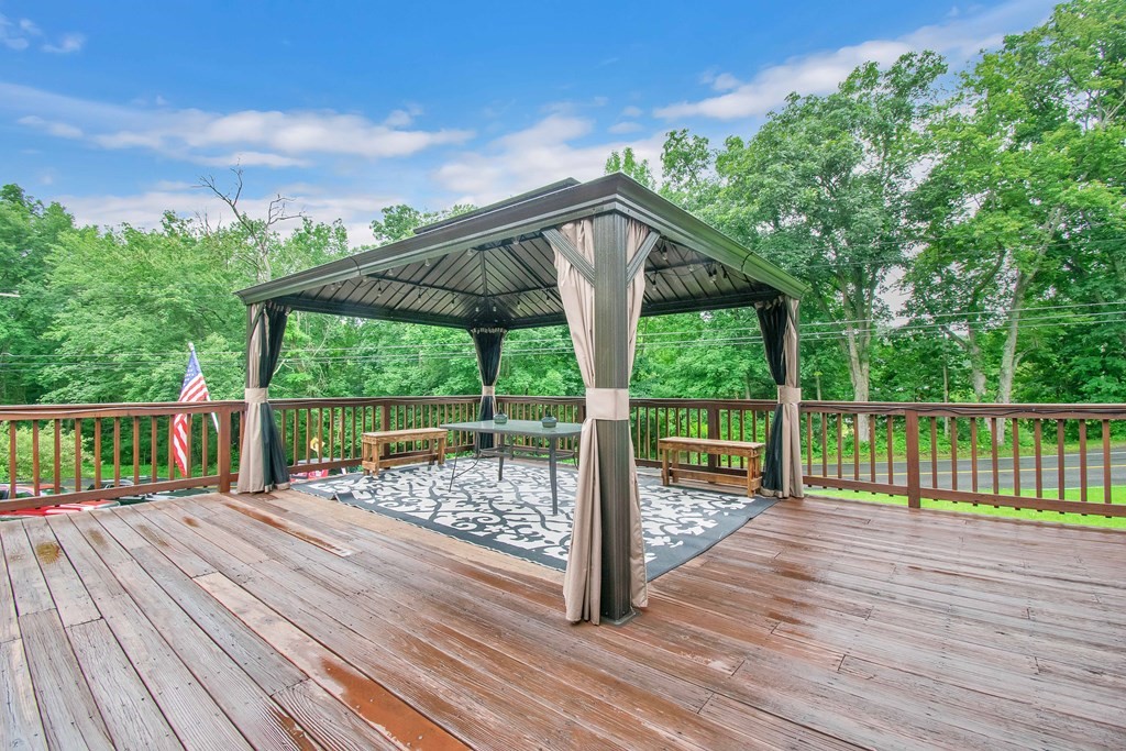 130 Warren Road Brimfield, MA 01010 - Photo 21 of 29 a balcony with wooden floor and outdoor space