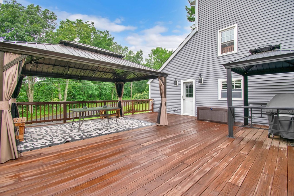 130 Warren Road Brimfield, MA 01010 - Photo 24 of 29 a view of a backyard with a deck