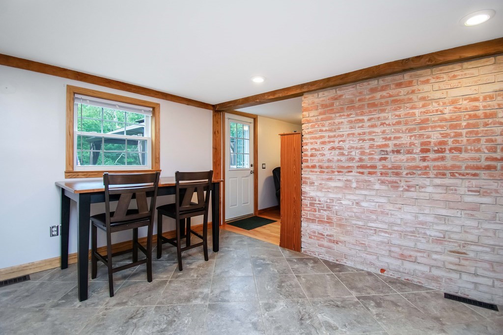 130 Warren Road Brimfield, MA 01010 - Photo 4 of 29 a workspace with furniture and a window