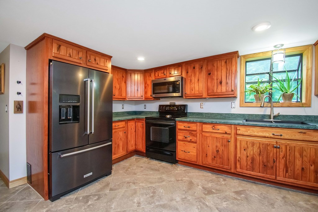 130 Warren Road Brimfield, MA 01010 - Photo 5 of 29 a kitchen with stainless steel appliances granite countertop a refrigerator stove top oven and sink