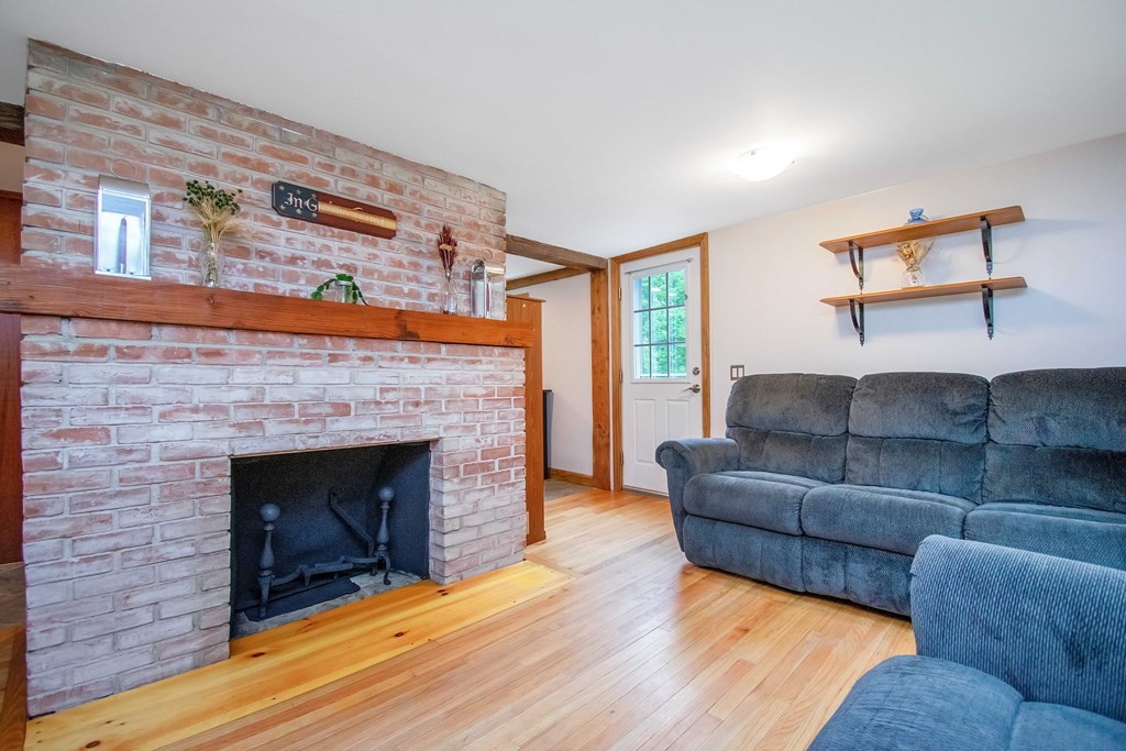 130 Warren Road Brimfield, MA 01010 - Photo 7 of 29 a living room with furniture and a fireplace