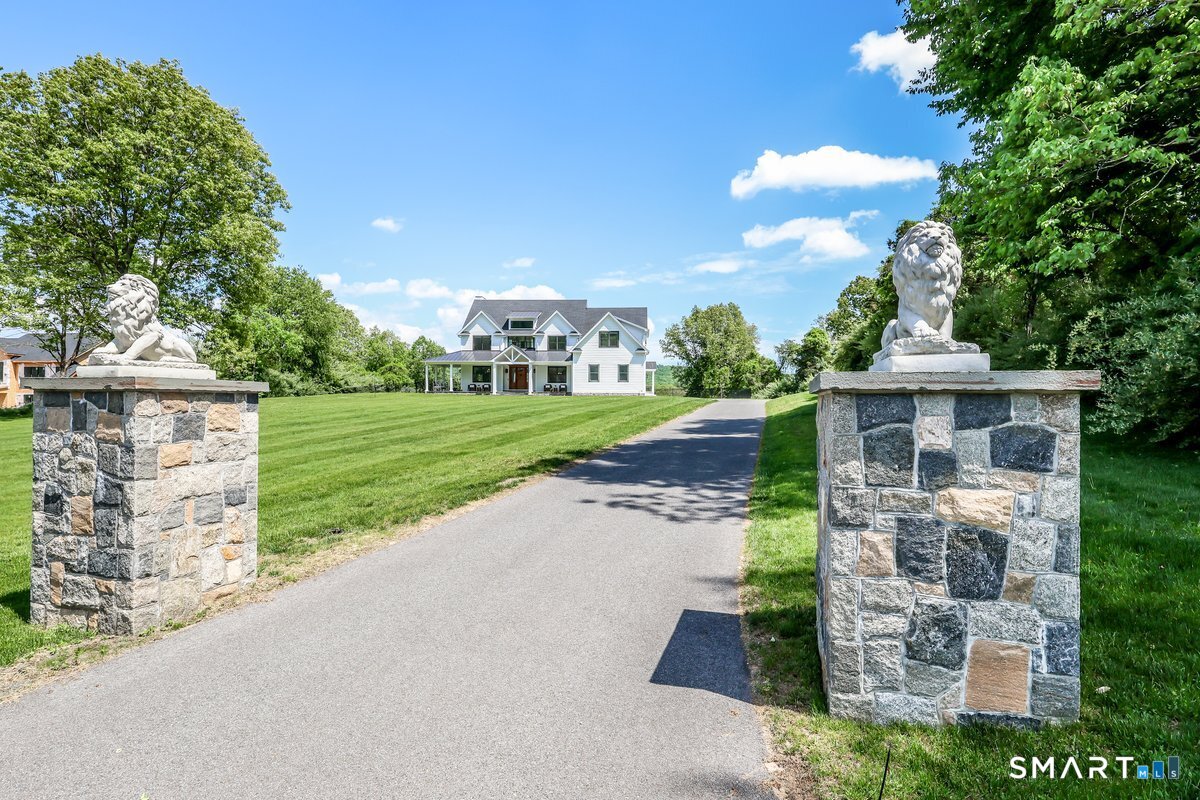 2 Pond View Lane Sherman, CT 06784 - Photo 2 of 40 a front view of a house with a yard