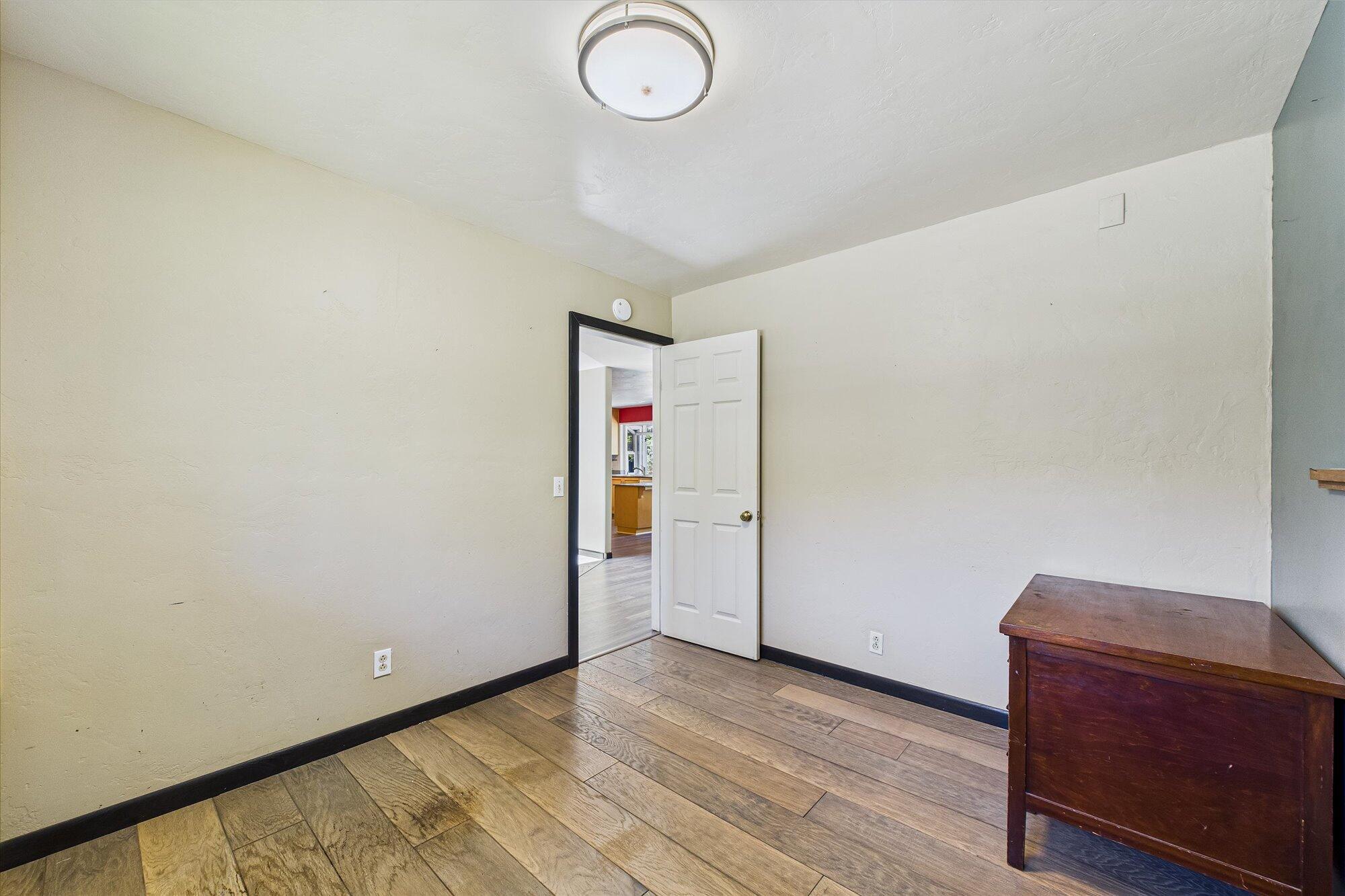 1945 Grange Road McKinleyville, CA 95519 - Photo 29 of 62 a view of empty room with wooden floor