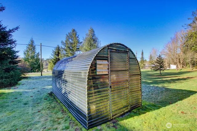 a house view with a sitting space and garden