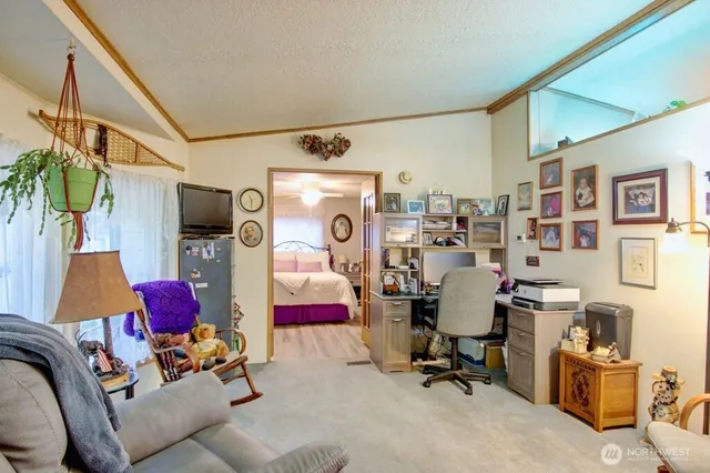 a view of a workspace with furniture and toys