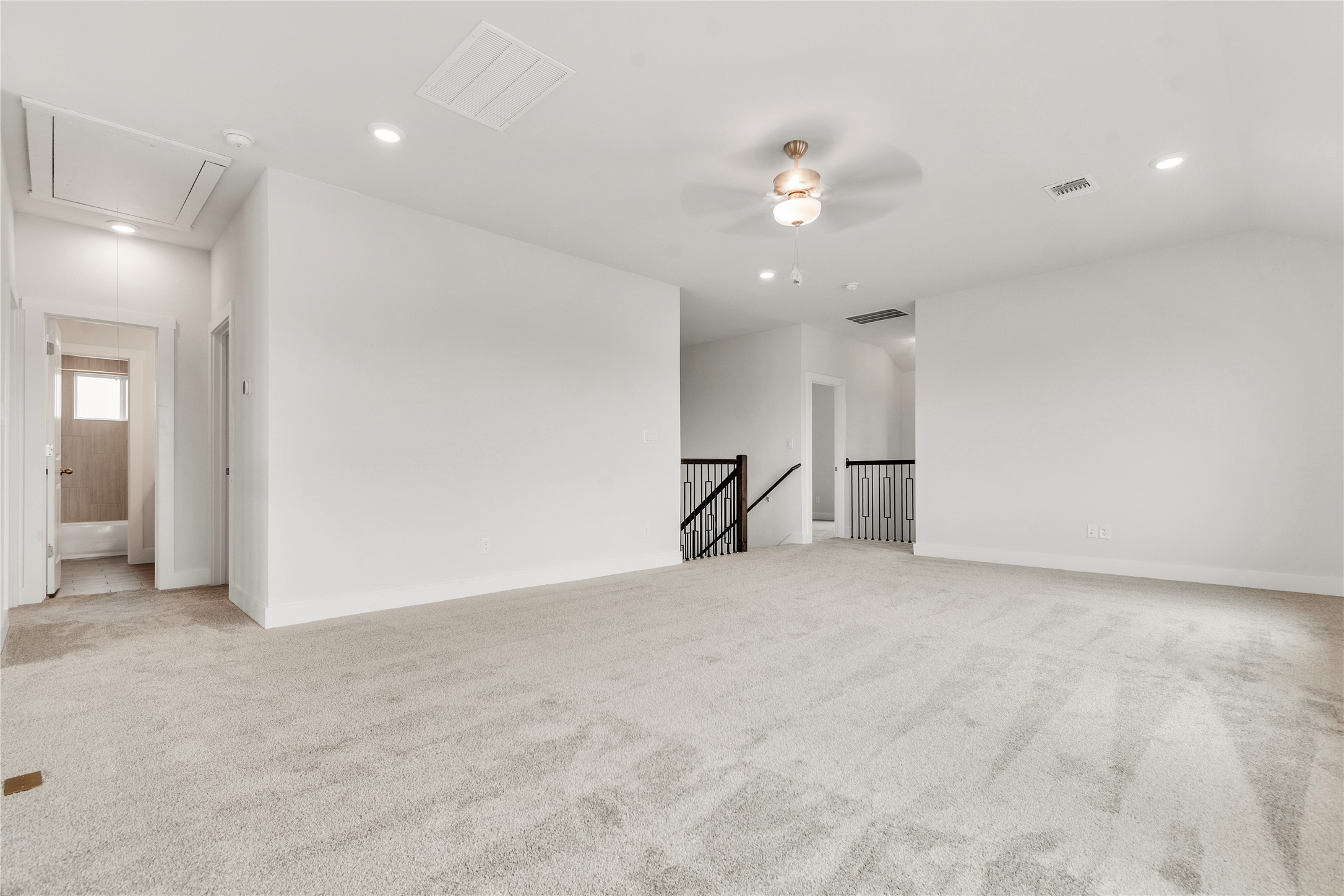 8500 Red Bottle Brush Road Lago Vista, TX 78645 - Photo 16 of 33 A spacious secondary living area features soft carpeting and recessed lighting.