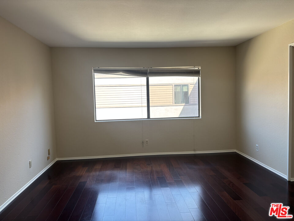 4541 Alla Road, Unit 5 Marina del Rey, CA 90292 - Photo 17 of 31 an empty room with wooden floor and windows