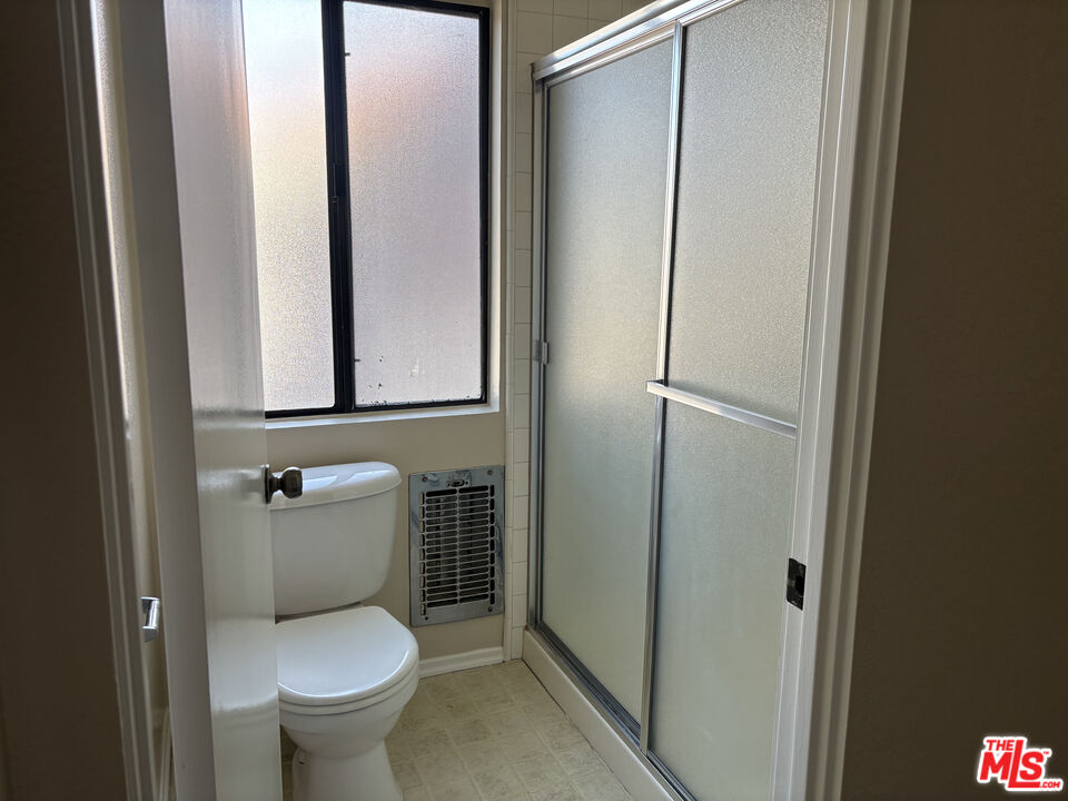 4541 Alla Road, Unit 5 Marina del Rey, CA 90292 - Photo 19 of 31 a white toilet sitting next to a bathroom sink