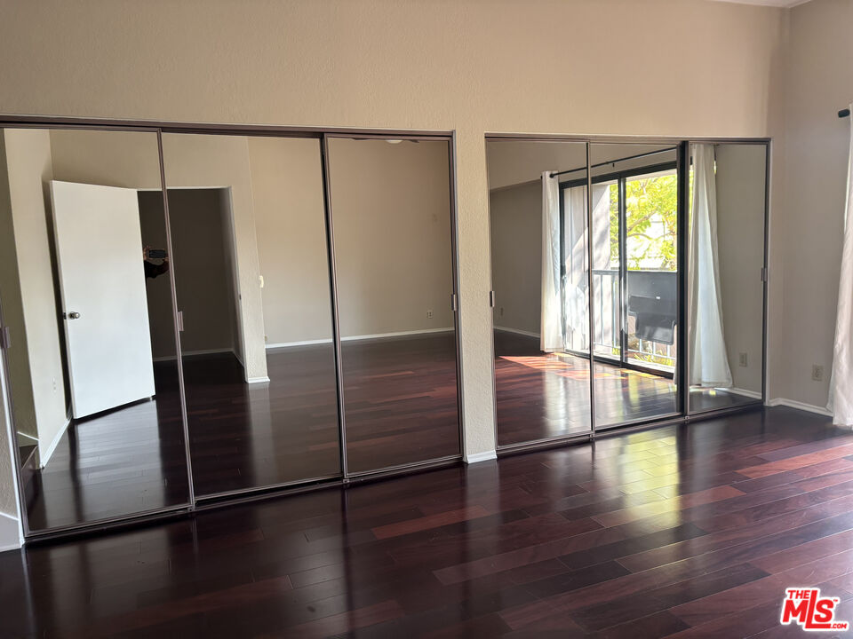 4541 Alla Road, Unit 5 Marina del Rey, CA 90292 - Photo 10 of 31 a view of an empty room with wooden floor and a window