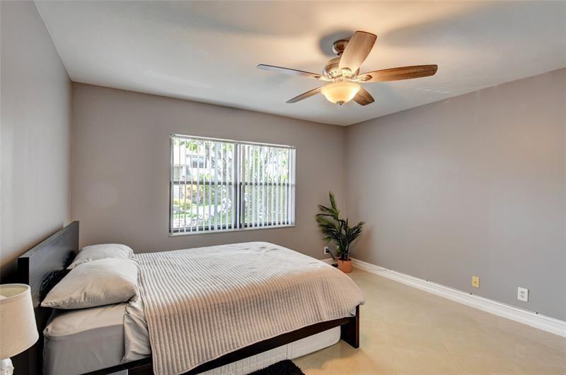 9316 Ketay Circle Boca Raton, FL 33428 - Photo 17 of 30 a bedroom with a bed and window