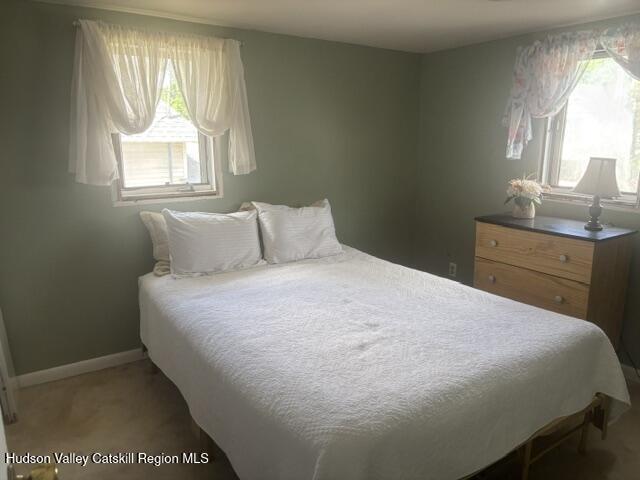 37004 Highway 23 Roxbury, NY 12434 - Photo 7 of 14 a bedroom with a bed and window with lamp