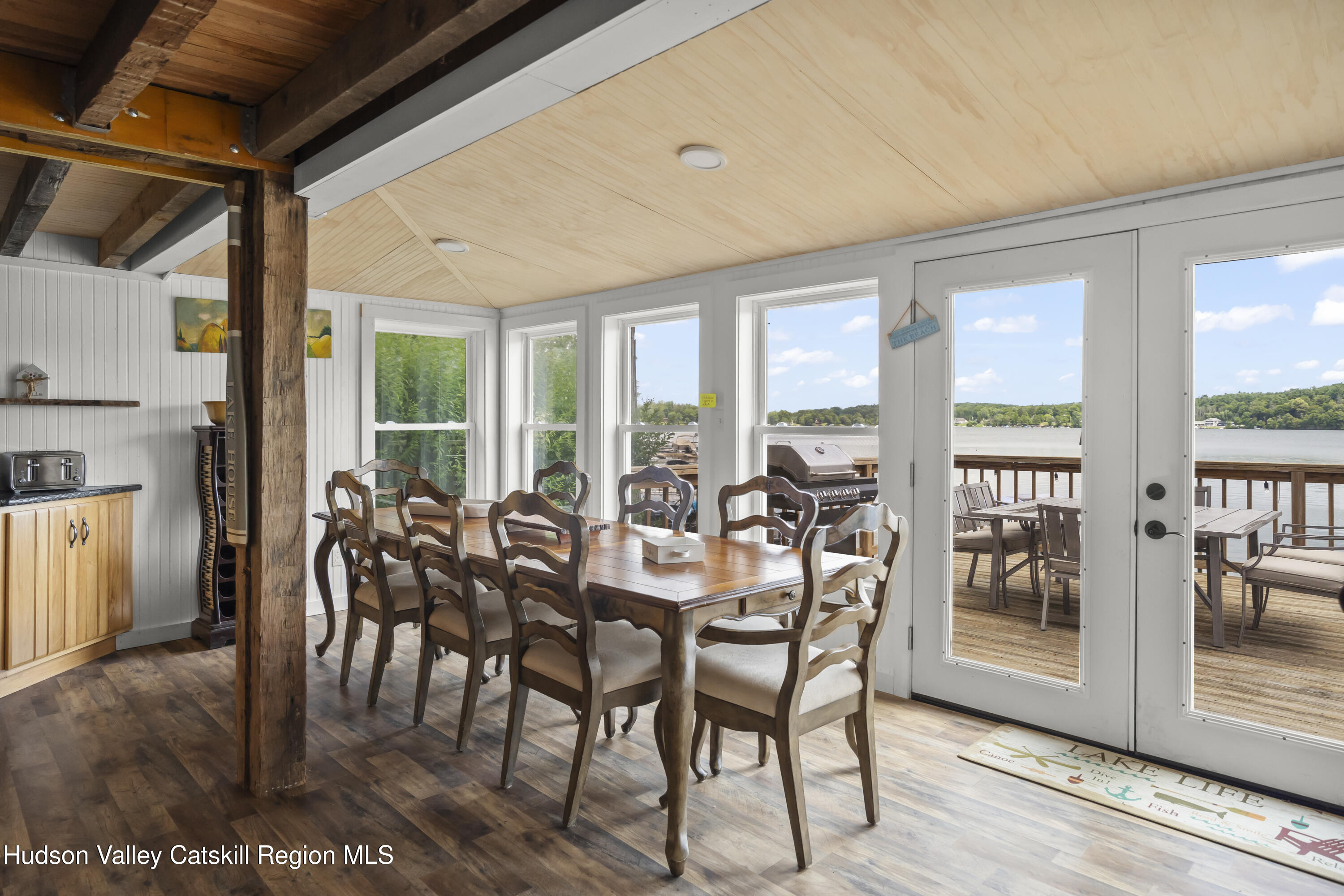44 Southwest Colony Road Hillsdale, NY 12529 - Photo 18 of 40 a view of a dining room with furniture large windows and wooden floor