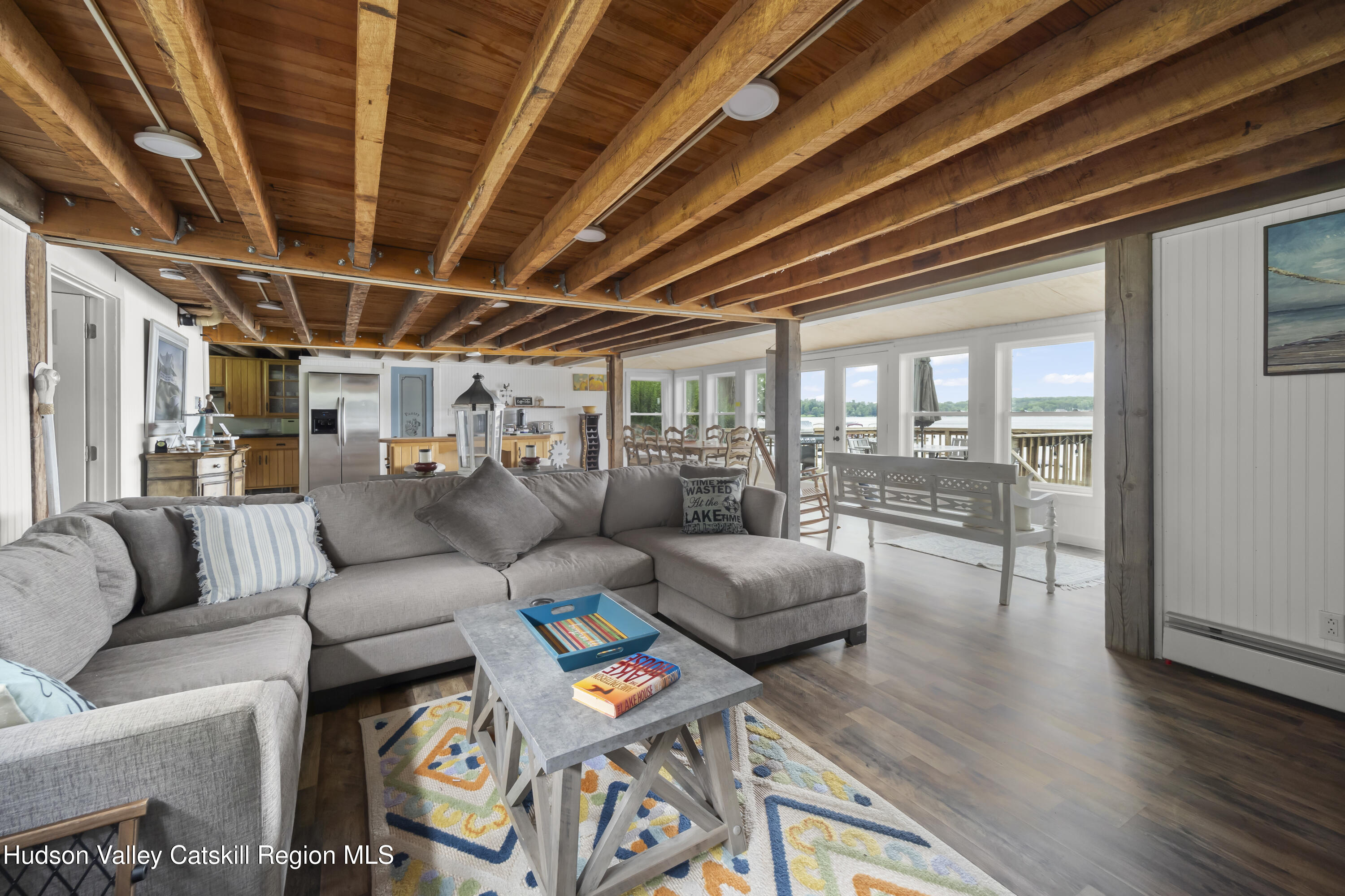 44 Southwest Colony Road Hillsdale, NY 12529 - Photo 20 of 40 a living room with furniture a wooden floor and next to a window