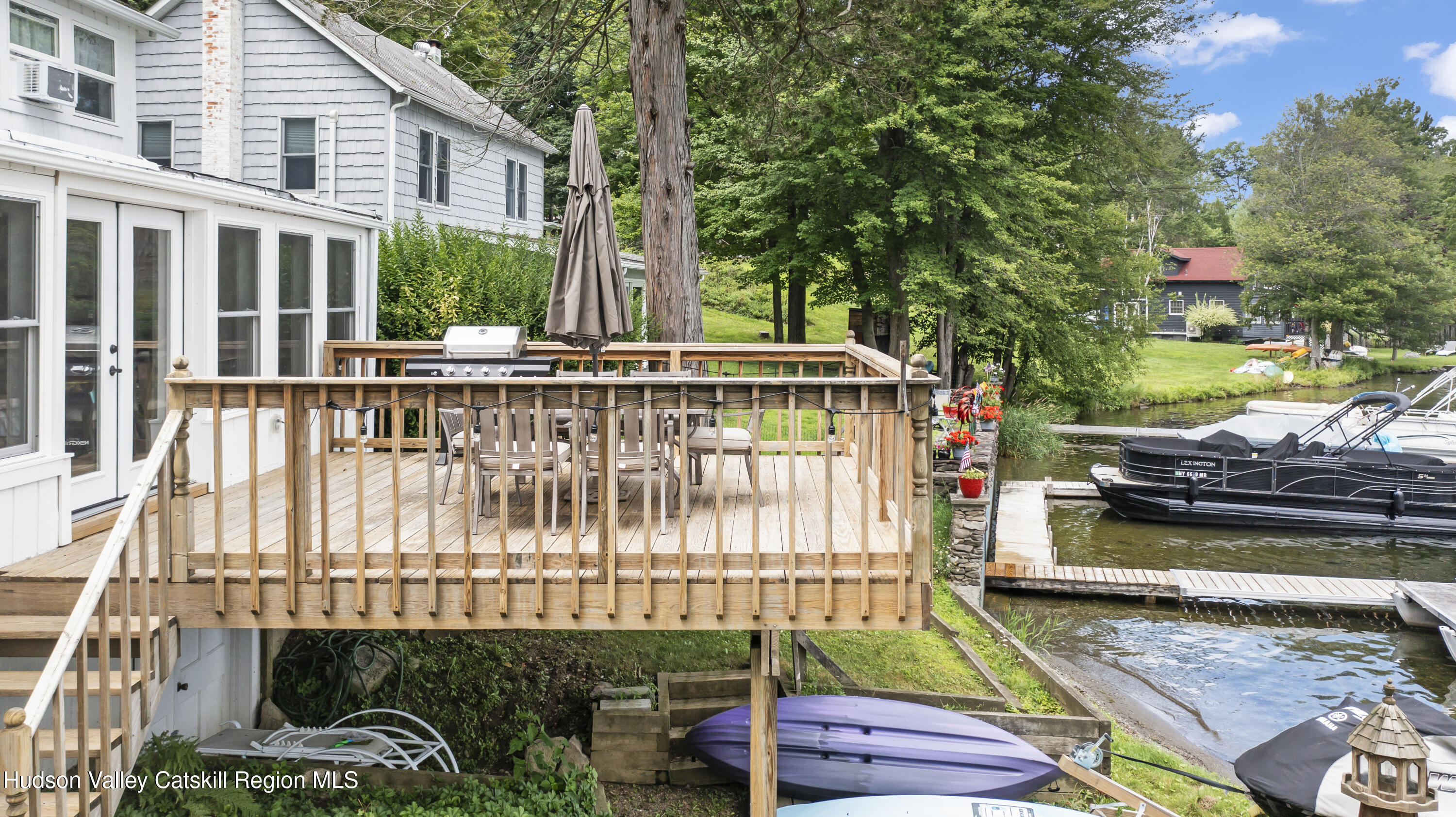 44 Southwest Colony Road Hillsdale, NY 12529 - Photo 6 of 40 a view of a wooden deck with a bench