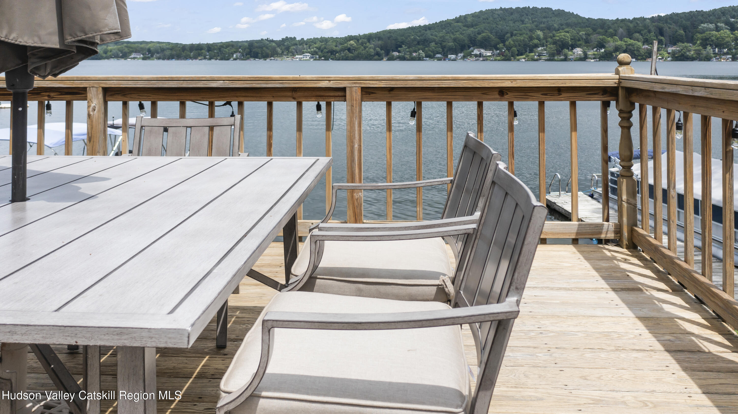 44 Southwest Colony Road Hillsdale, NY 12529 - Photo 8 of 40 a balcony with wooden floor and outdoor seating