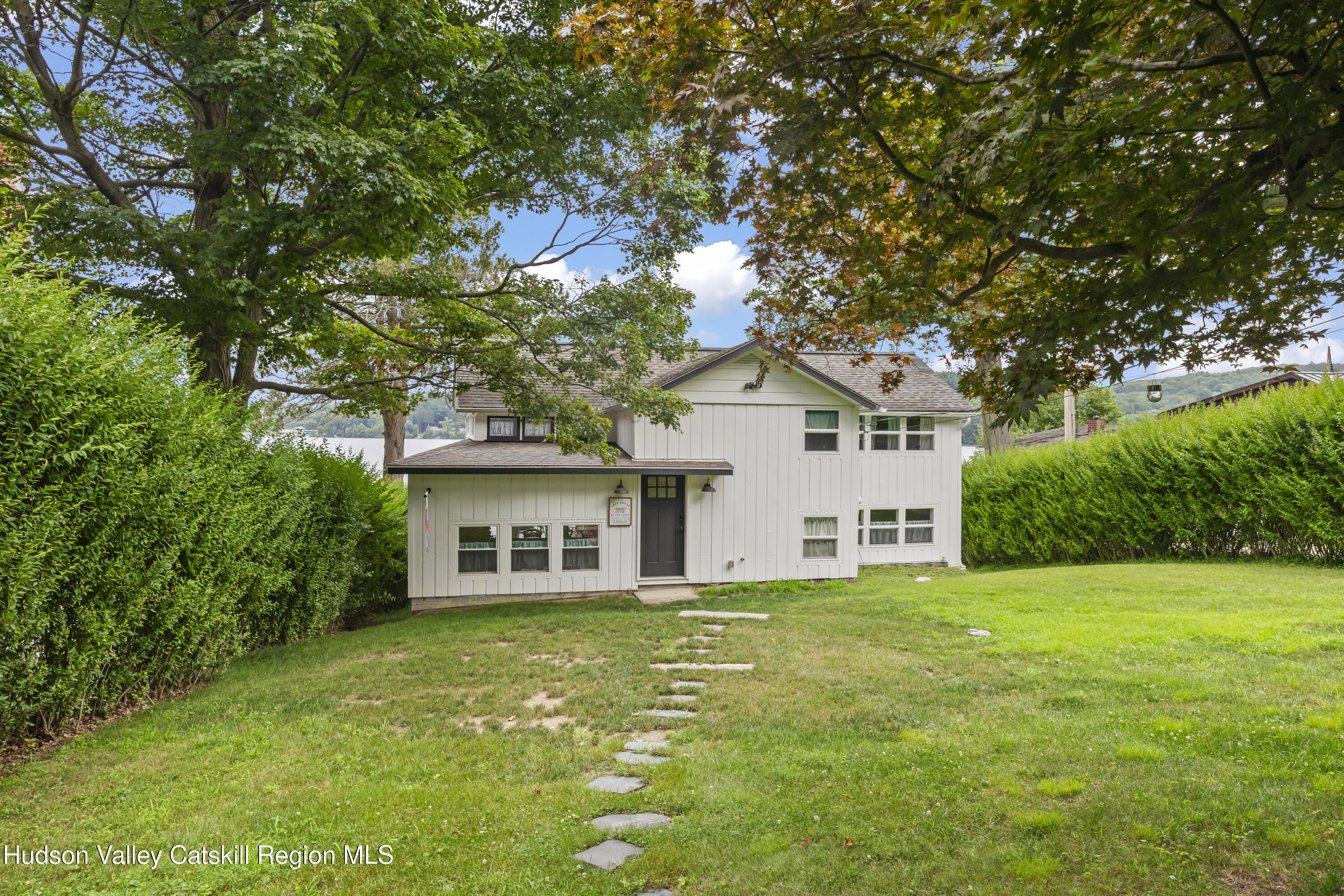 44 Southwest Colony Road Hillsdale, NY 12529 - Photo 9 of 40 a front view of a house with a garden