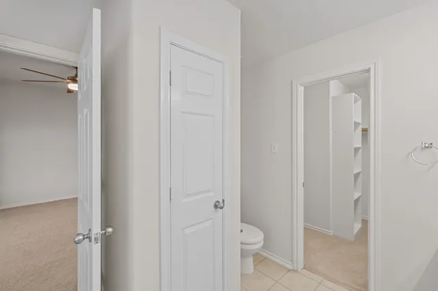 a bathroom view of a toilet and a sink