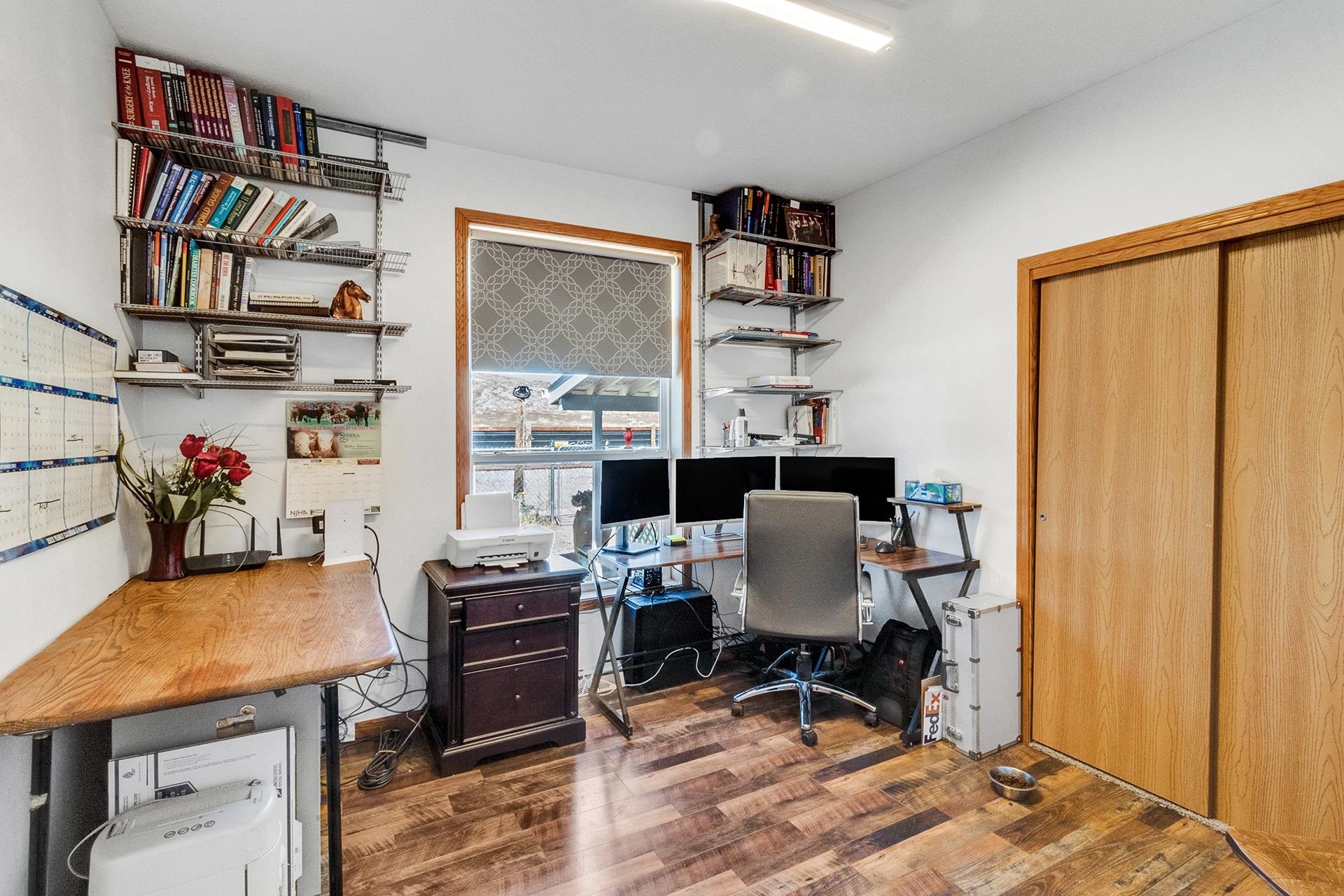 1724 O Road Fruita, CO 81521 - Photo 18 of 42 a workspace with furniture and a book shelf