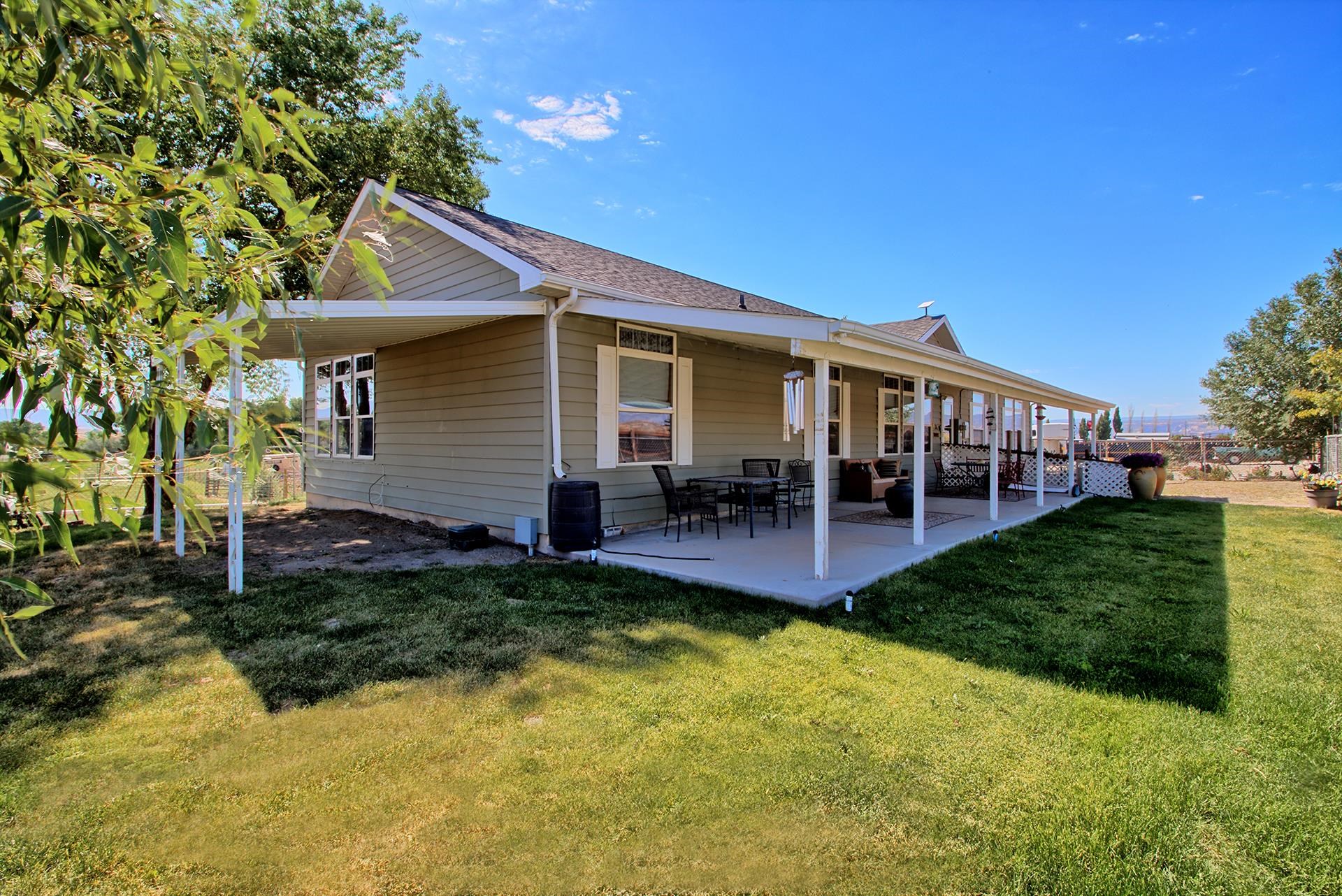 1724 O Road Fruita, CO 81521 - Photo 2 of 42 a view of a house with a yard porch and sitting area