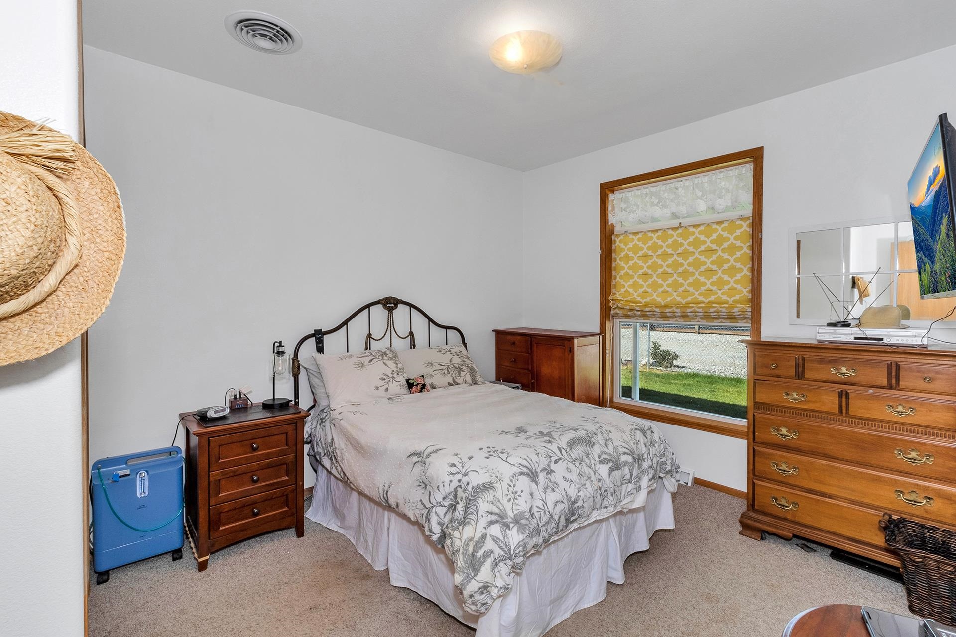 1724 O Road Fruita, CO 81521 - Photo 21 of 42 a bedroom with a bed and a dresser