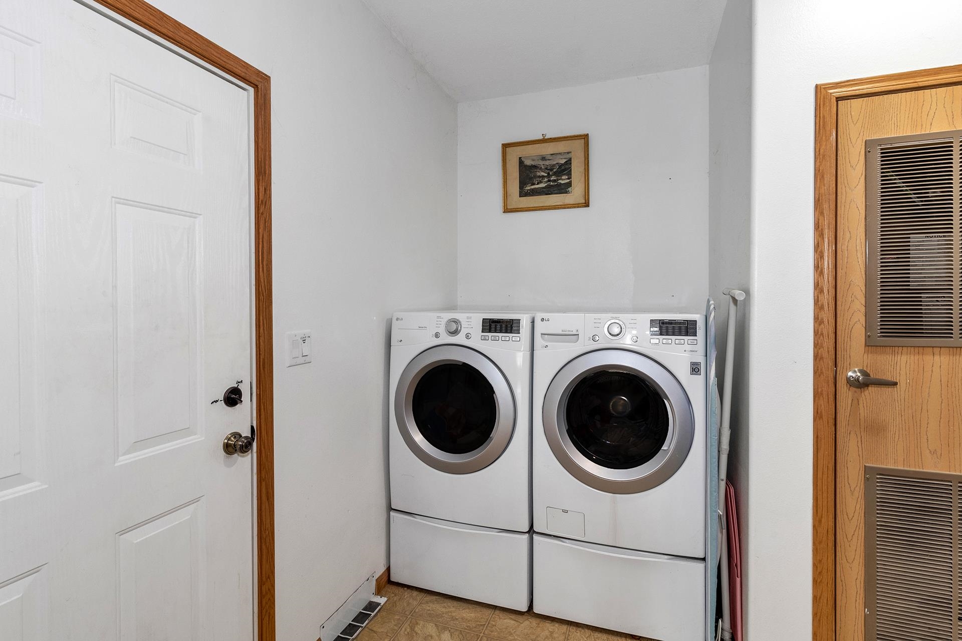 1724 O Road Fruita, CO 81521 - Photo 22 of 42 a utility room with dryer washer and a view of bedroom