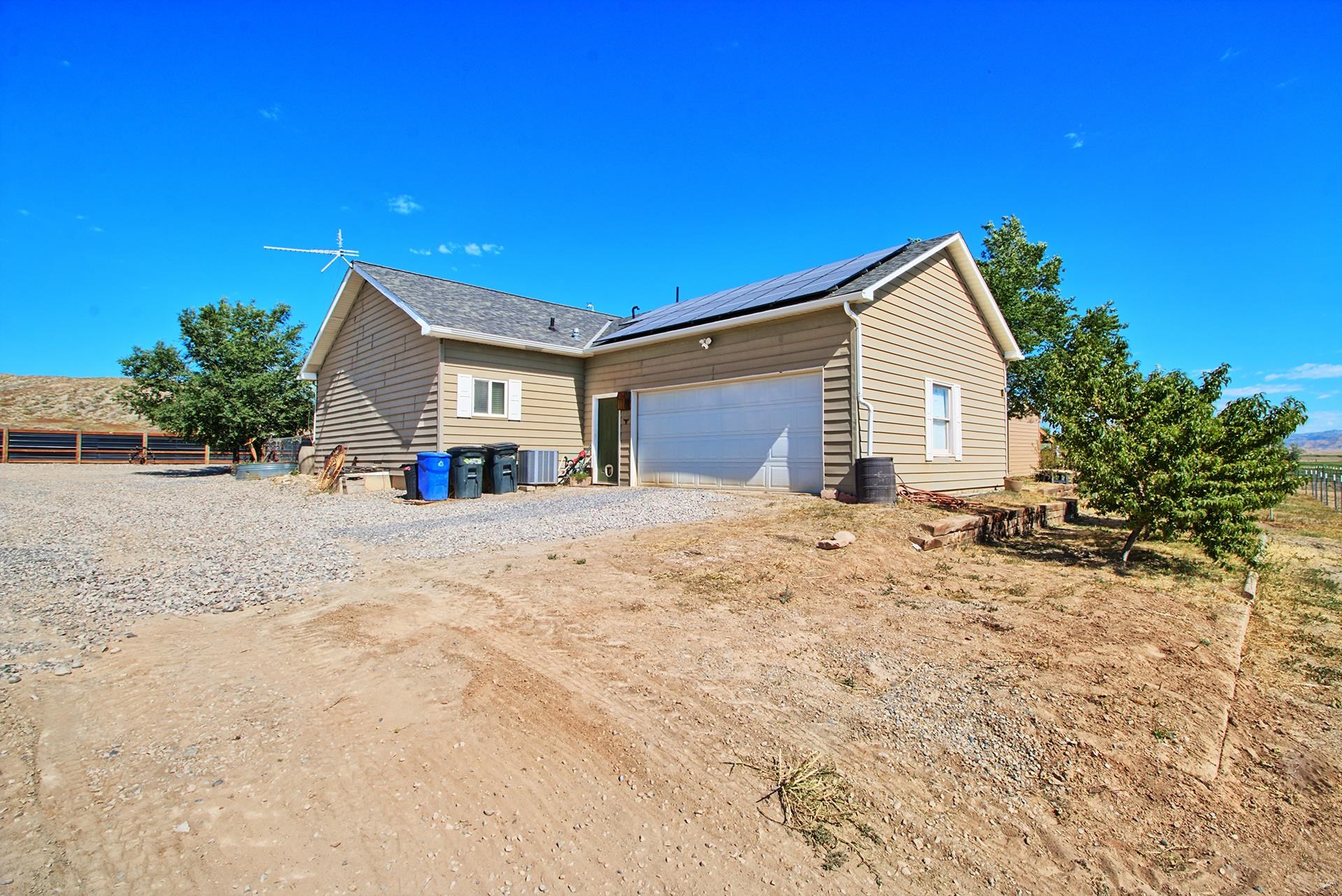 1724 O Road Fruita, CO 81521 - Photo 26 of 42 a view of a house with a snow on the road