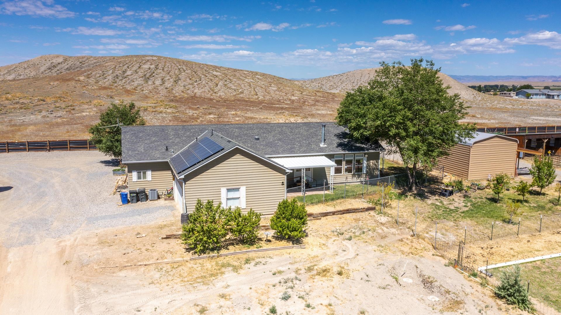 1724 O Road Fruita, CO 81521 - Photo 27 of 42 a view of a house with a snow in the background