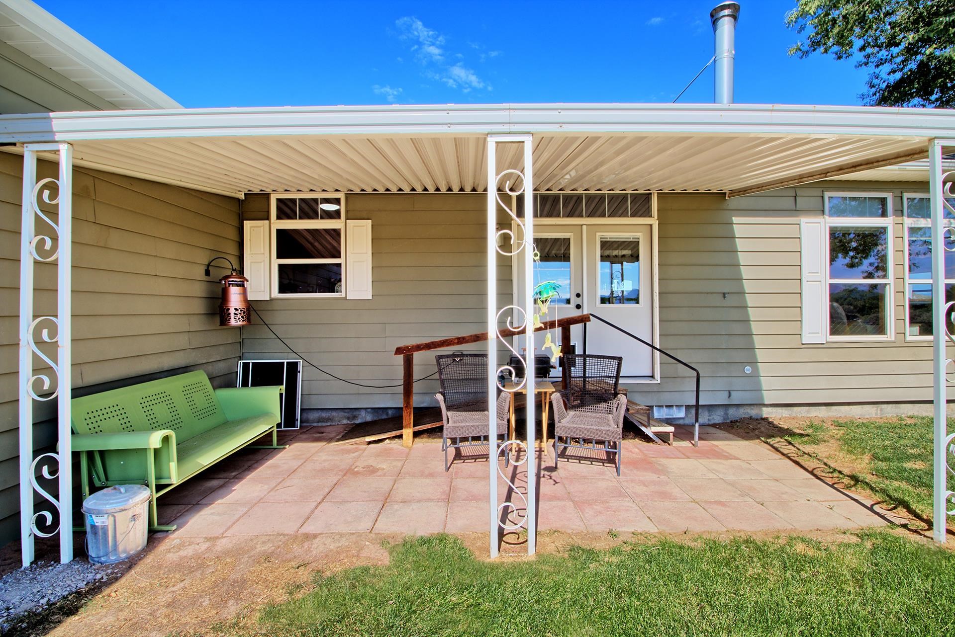 1724 O Road Fruita, CO 81521 - Photo 28 of 42 a view of a house with backyard and sitting area