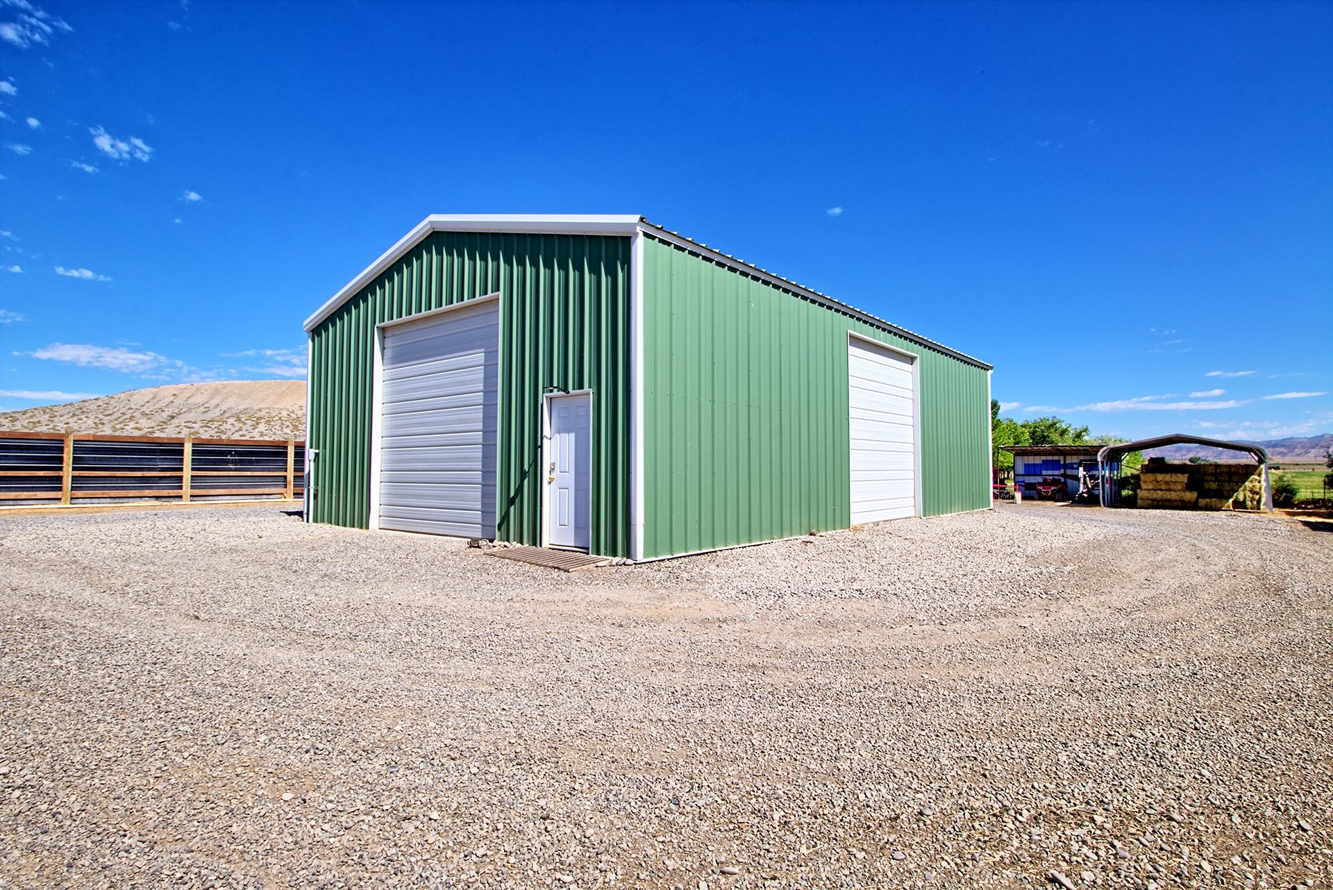 1724 O Road Fruita, CO 81521 - Photo 38 of 42 a view of a house with a yard and garage