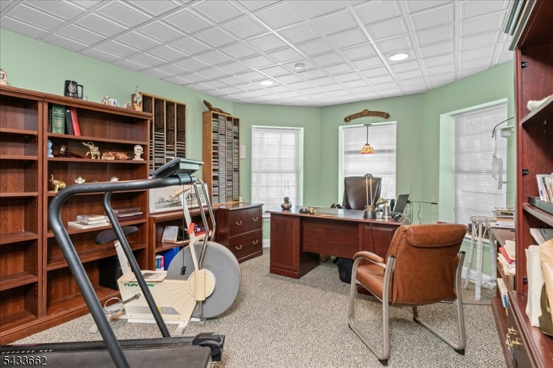 15 Bracken Hill Road Hamburg, NJ 07419 - Photo 32 of 44 a room with furniture a bookshelf and a window