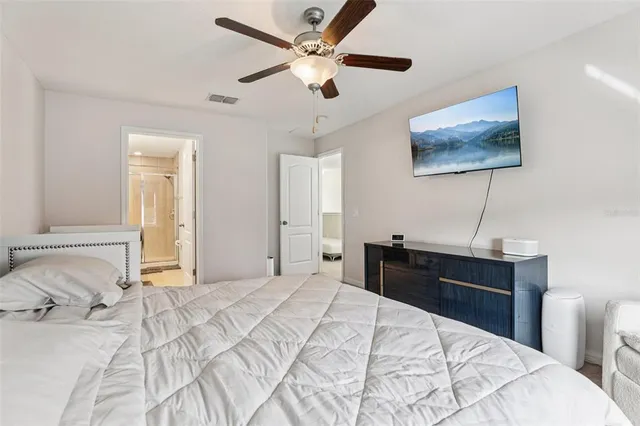 a bathroom with a double vanity sink mirror and toilet