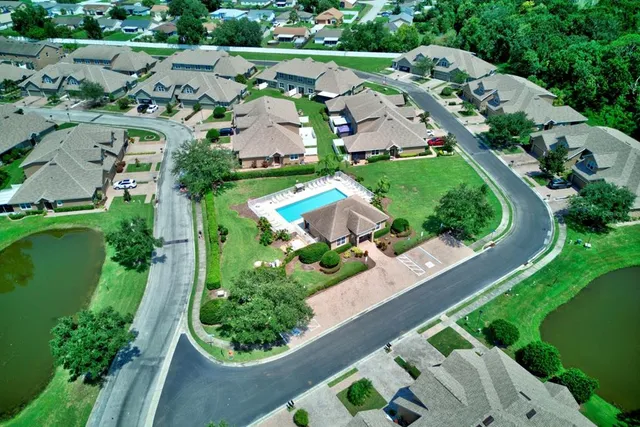 a view of house with outdoor space and swimming pool