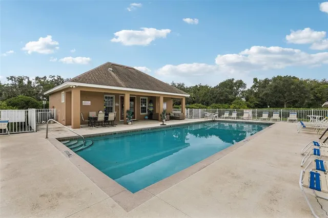 a living room with furniture and flowers
