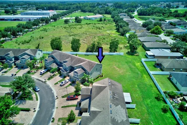an aerial view of a house with a garden