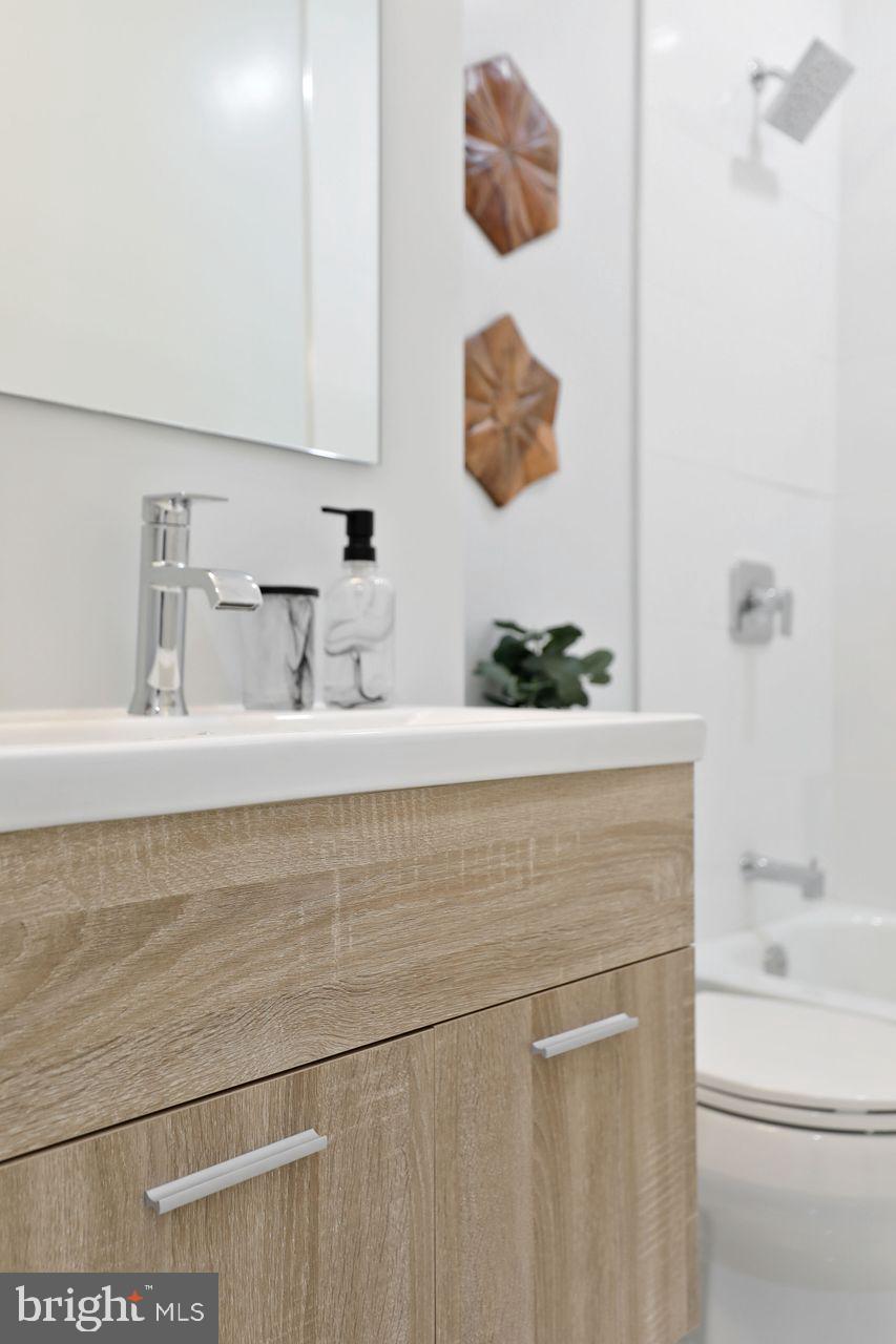 1023 Florida Avenue Northeast Washington, DC 20002 - Photo 12 of 24 a bathroom with a bathtub and a sink