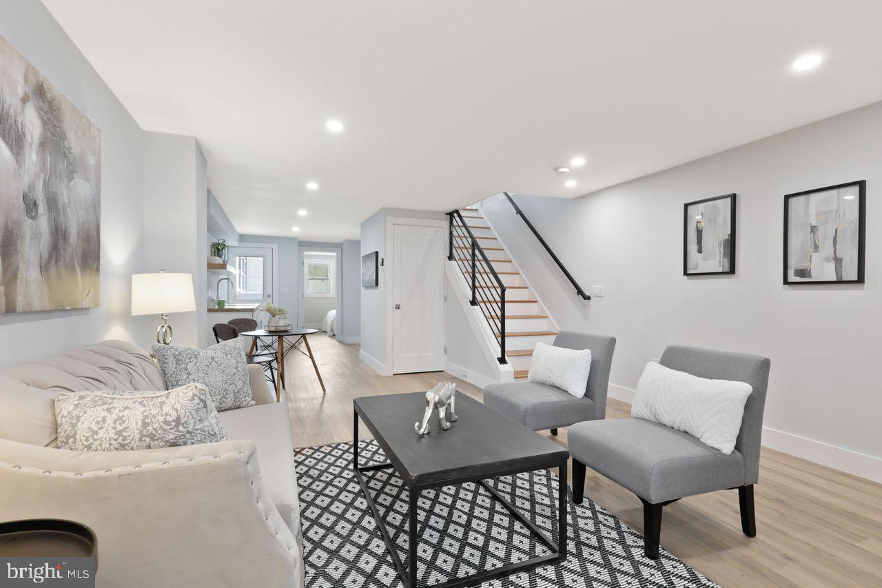 1023 Florida Avenue Northeast Washington, DC 20002 - Photo 17 of 24 a living room with furniture and wooden floor