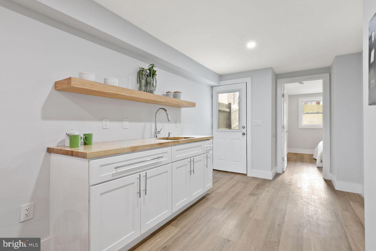 1023 Florida Avenue Northeast Washington, DC 20002 - Photo 22 of 24 a bathroom with a sink and a mirror