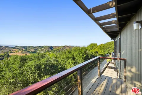 a bathroom with a sink mirror and shower