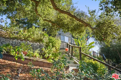 a bathroom with a sink a mirror and a shower