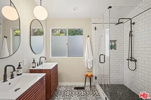 a view of a patio with couches table and chairs and potted plants