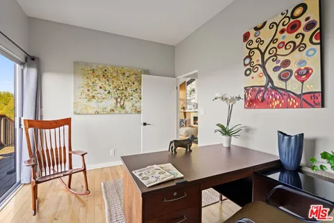 a bedroom with furniture and a window