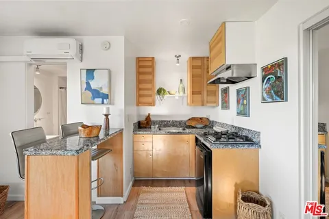 a view of a house with backyard porch and sitting area