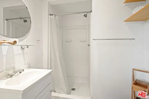 a view of a house with a yard and tree s