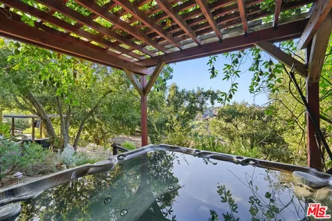 a view of a balcony with furniture and a window