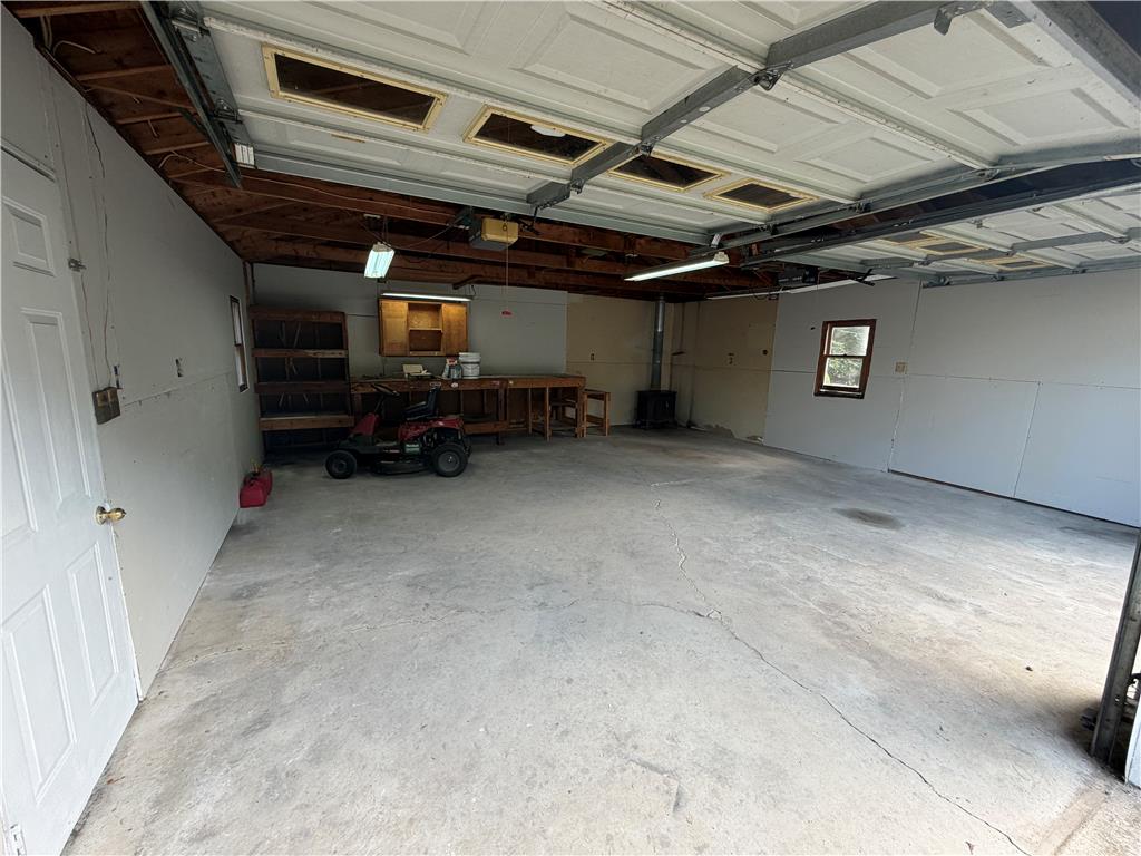 5720 Memorial Road Germansville, PA 18053 - Photo 24 of 30 A spacious garage with ample room for vehicles and a dedicated workbench area for projects.
