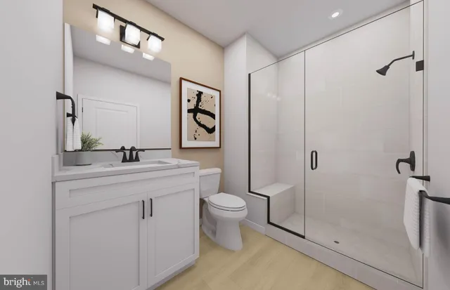 a bathroom with a toilet sink and shower