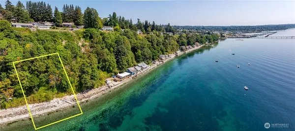 a view of a lake with a yard