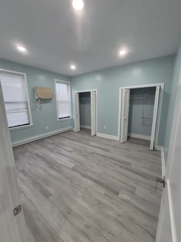 a view of a brick building next to a yard