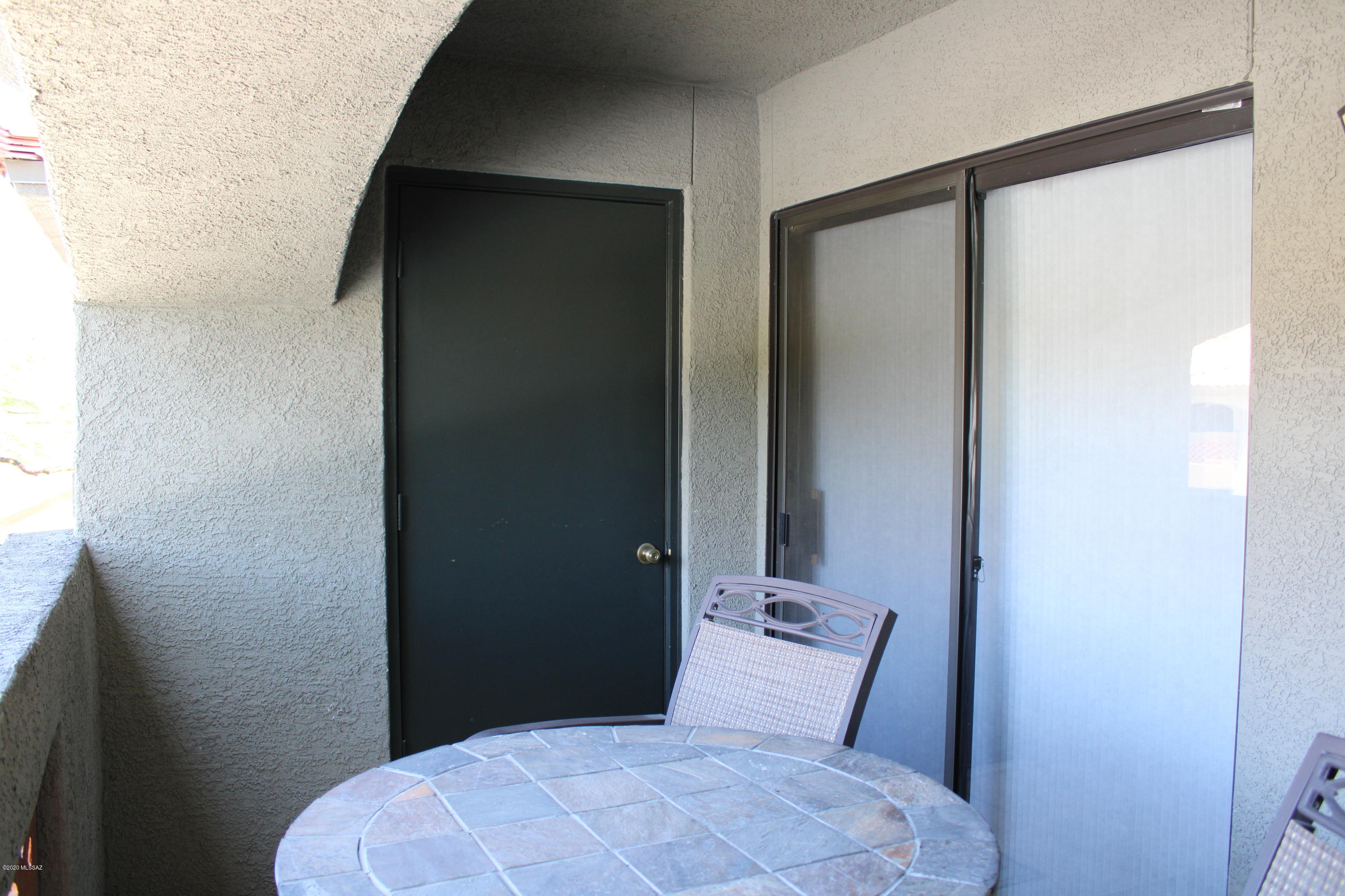 5751 North Kolb Road, Unit 36203 Tucson, AZ 85750 - Photo 23 of 25 a bedroom with a bed and a mirror