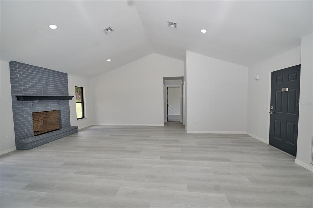 119 Ridgecrest Drive Eustis, FL 32726 - Photo 24 of 52 a view of an empty room with a fireplace
